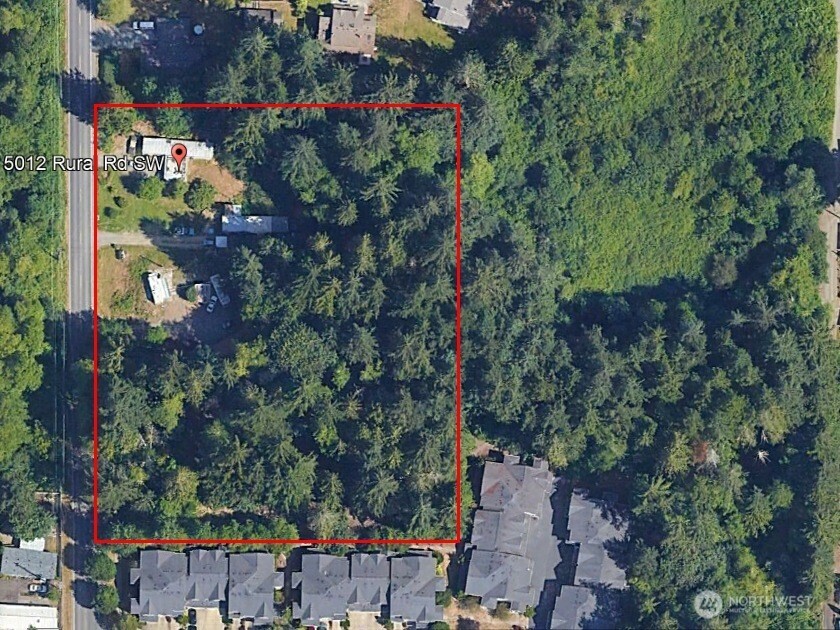 an aerial view of a houses with outdoor space