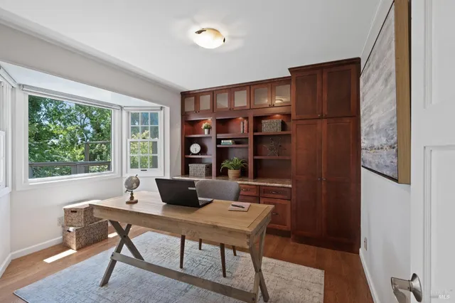 a work room with furniture and a window