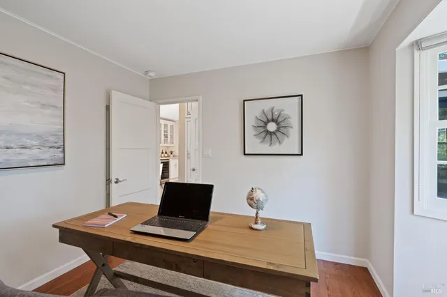 a view of a workspace with furniture