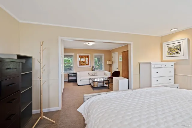 a bedroom with a bed and furniture