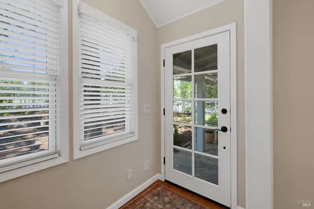 a view of a room that has a large window