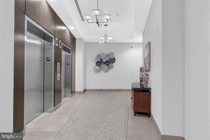 50 Florida Avenue Northeast, Unit 209 Washington, DC 20002 - Photo 24 of 29 a view of a hallway with a chandelier