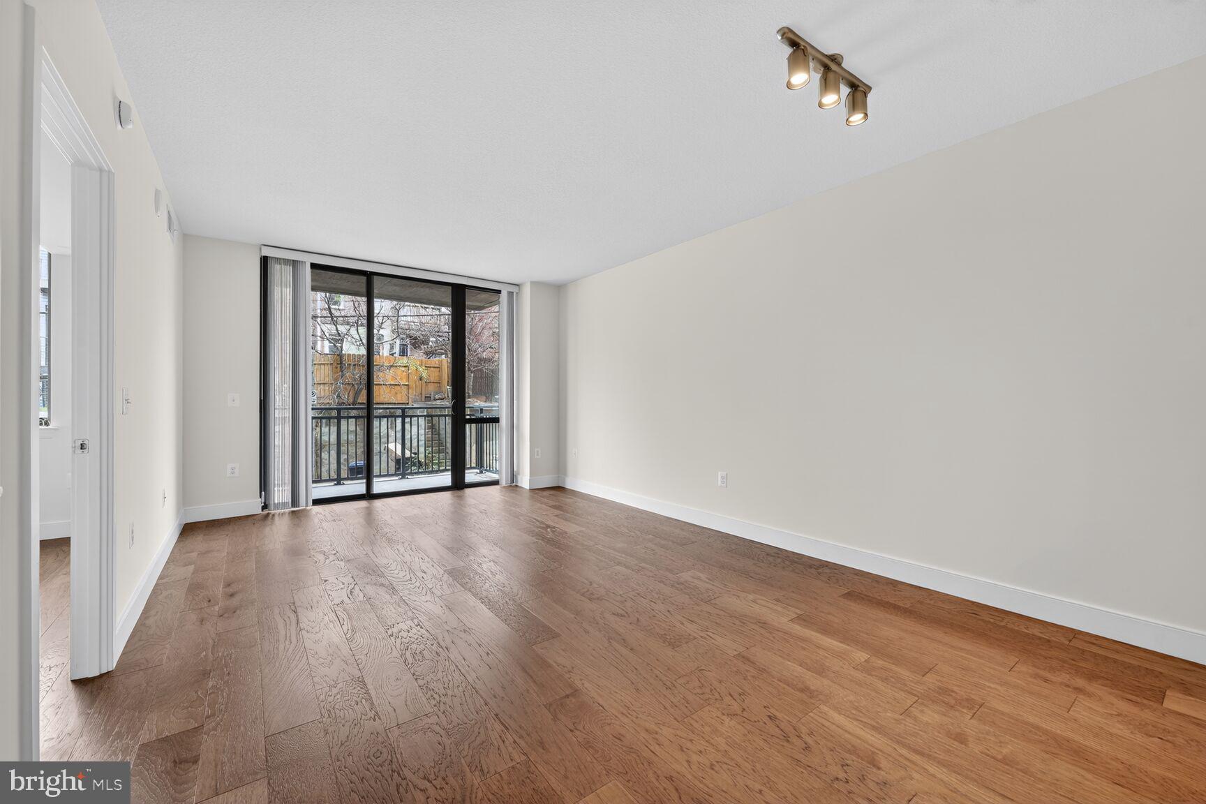 50 Florida Avenue Northeast, Unit 209 Washington, DC 20002 - Photo 6 of 29 wooden floor in an empty room with a window