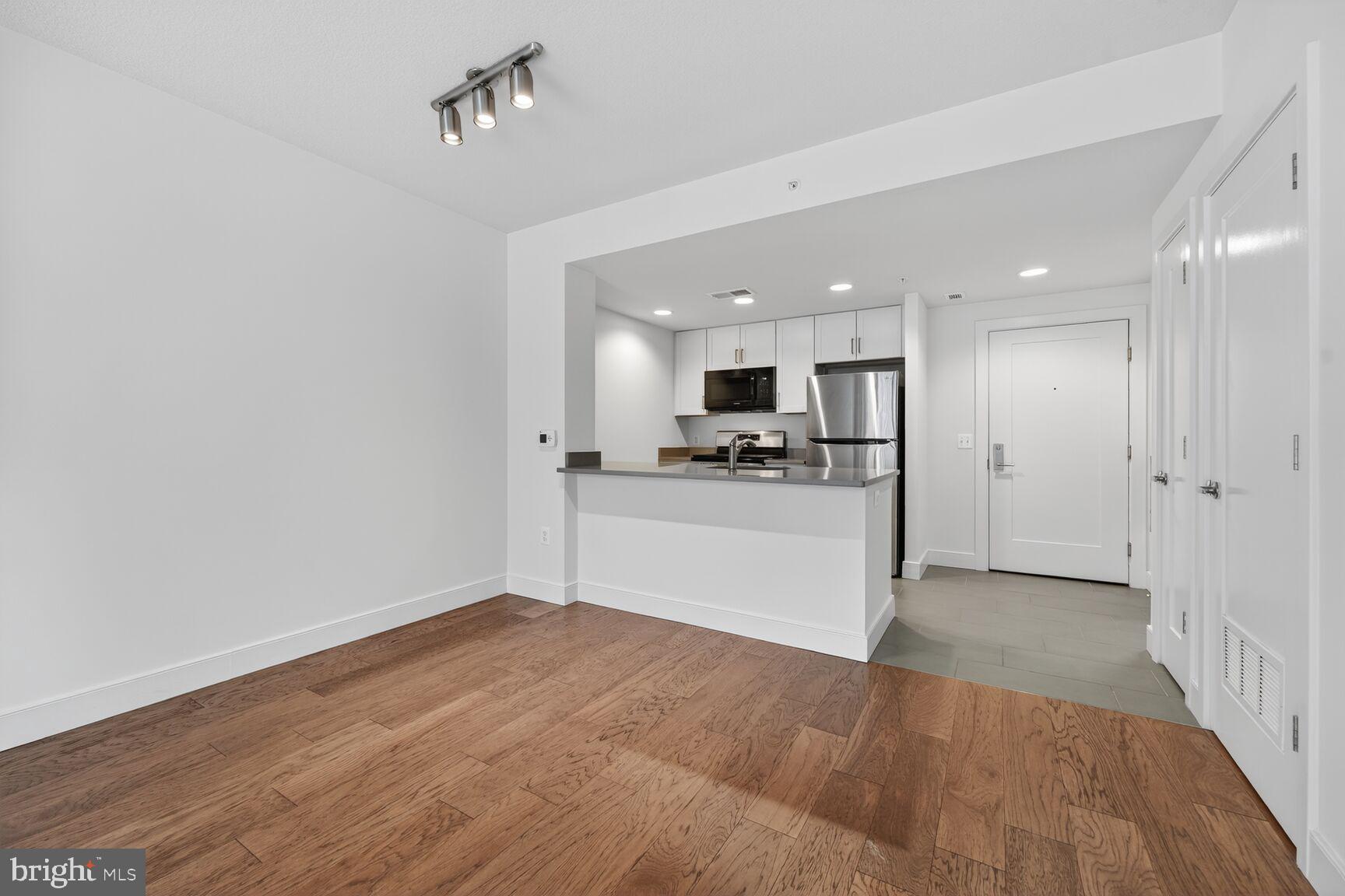 50 Florida Avenue Northeast, Unit 209 Washington, DC 20002 - Photo 9 of 29 a view of kitchen with wooden floor and electronic appliances