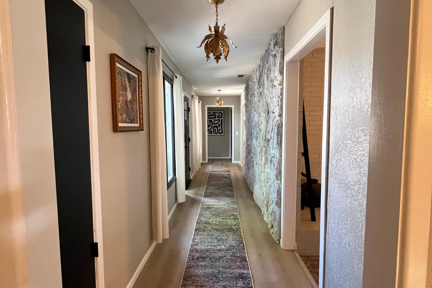 8508 Jordan Drive Lubbock, TX 79423 - Photo 19 of 34 a view of a hallway with a dining room