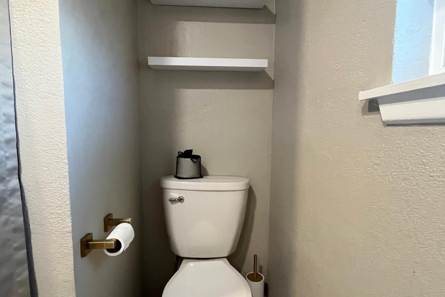 8508 Jordan Drive Lubbock, TX 79423 - Photo 24 of 34 a white toilet sitting next to a white sink