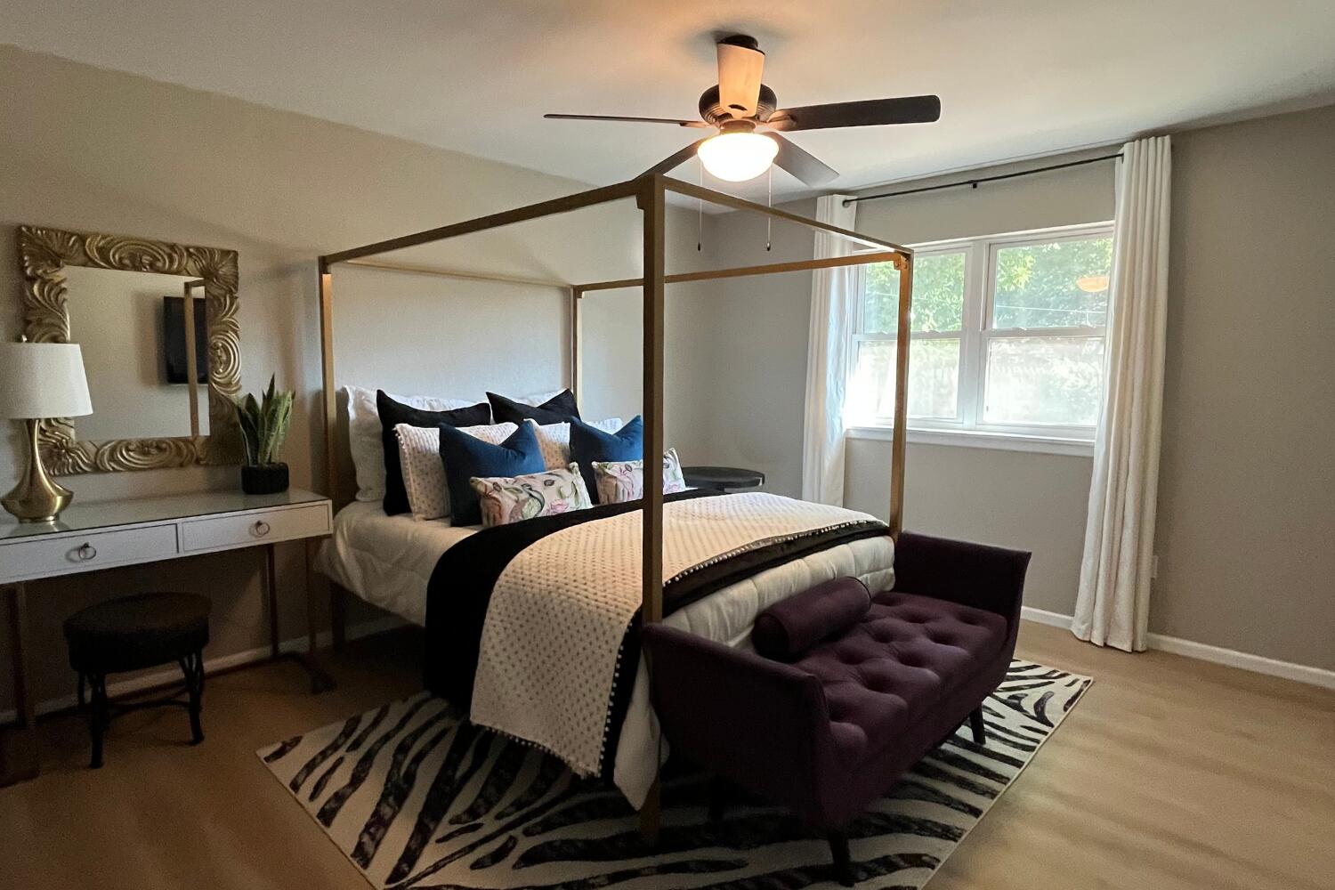 8508 Jordan Drive Lubbock, TX 79423 - Photo 26 of 34 a bedroom with a bed a chandelier and a window