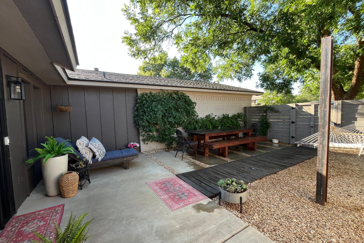 8508 Jordan Drive Lubbock, TX 79423 - Photo 3 of 34 a backyard of a house with barbeque oven table and chairs