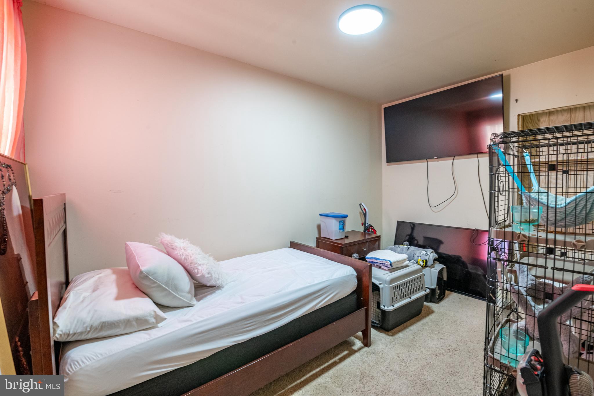 1711 Perkiomen Avenue Reading, PA 19602 - Photo 15 of 20 a bedroom with bed and a flat screen tv