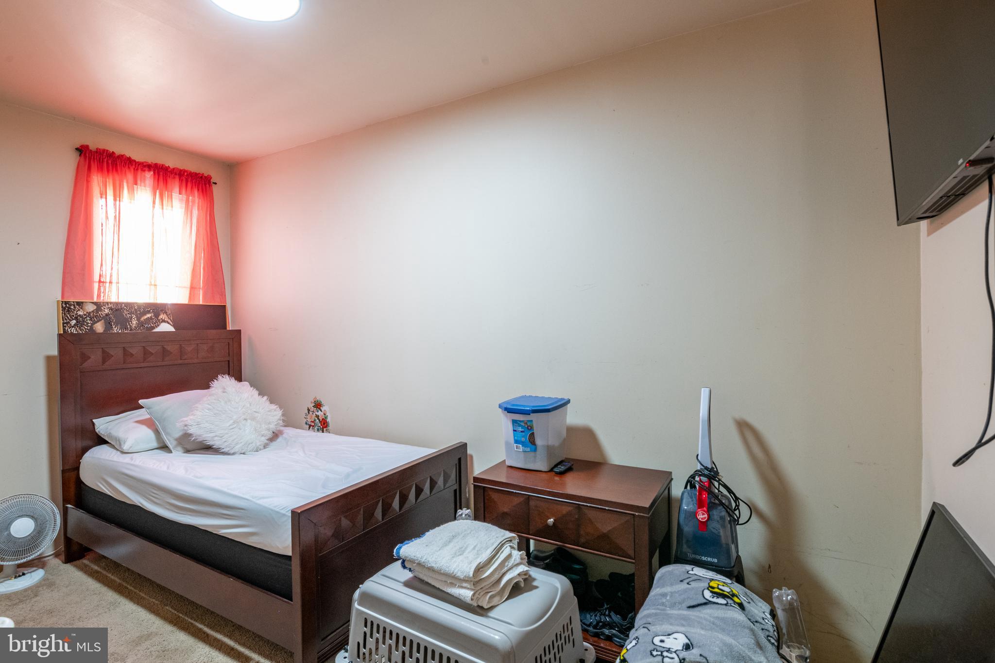 1711 Perkiomen Avenue Reading, PA 19602 - Photo 16 of 20 a bedroom with a bed and wooden floor