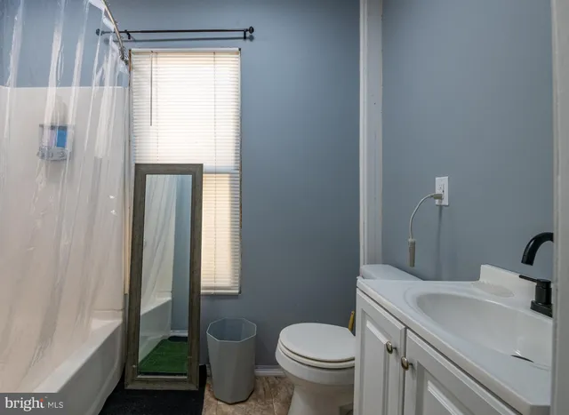 a view of a balcony with chair and table