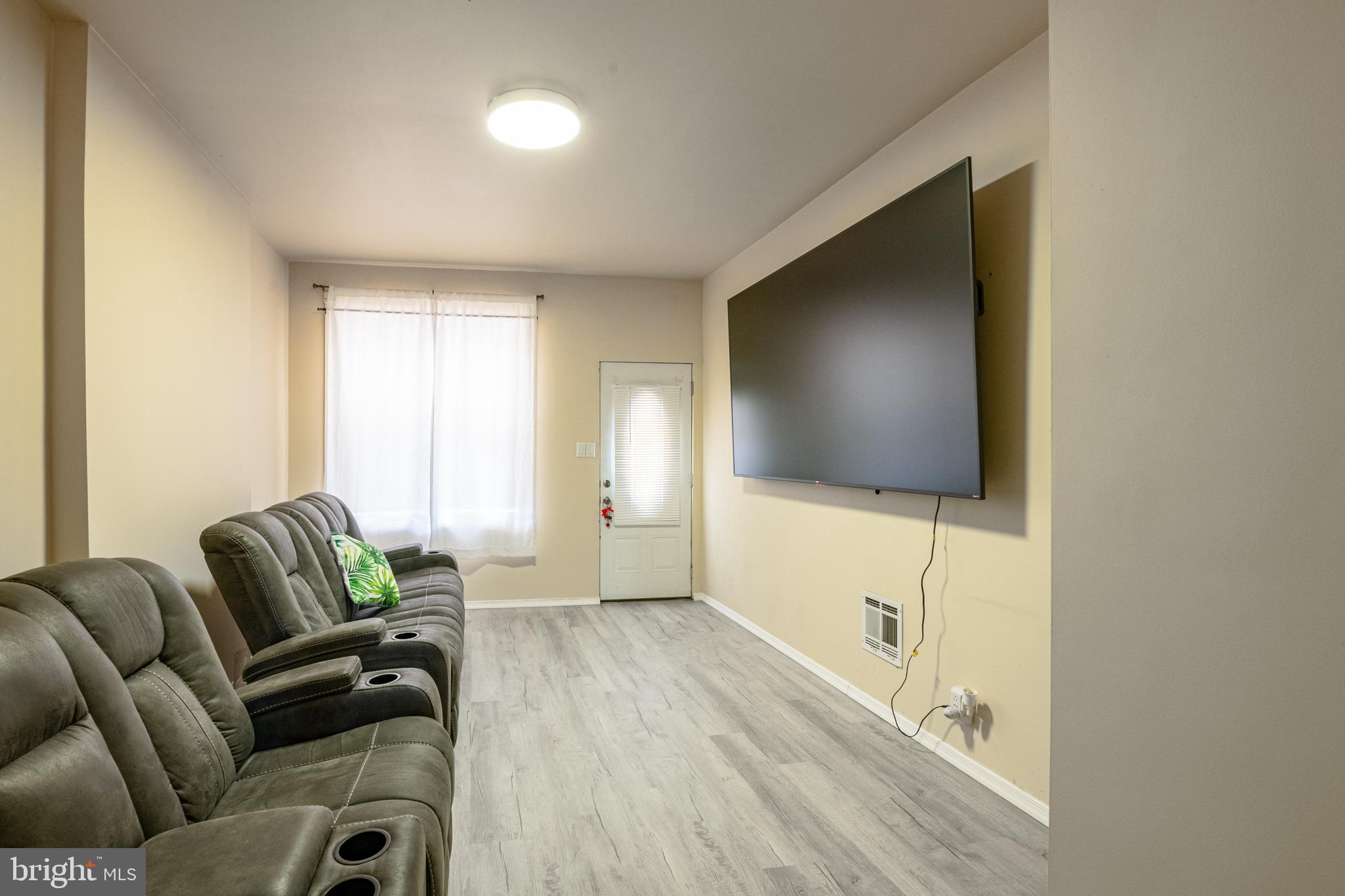 1711 Perkiomen Avenue Reading, PA 19602 - Photo 5 of 20 a living room with furniture and a flat screen tv