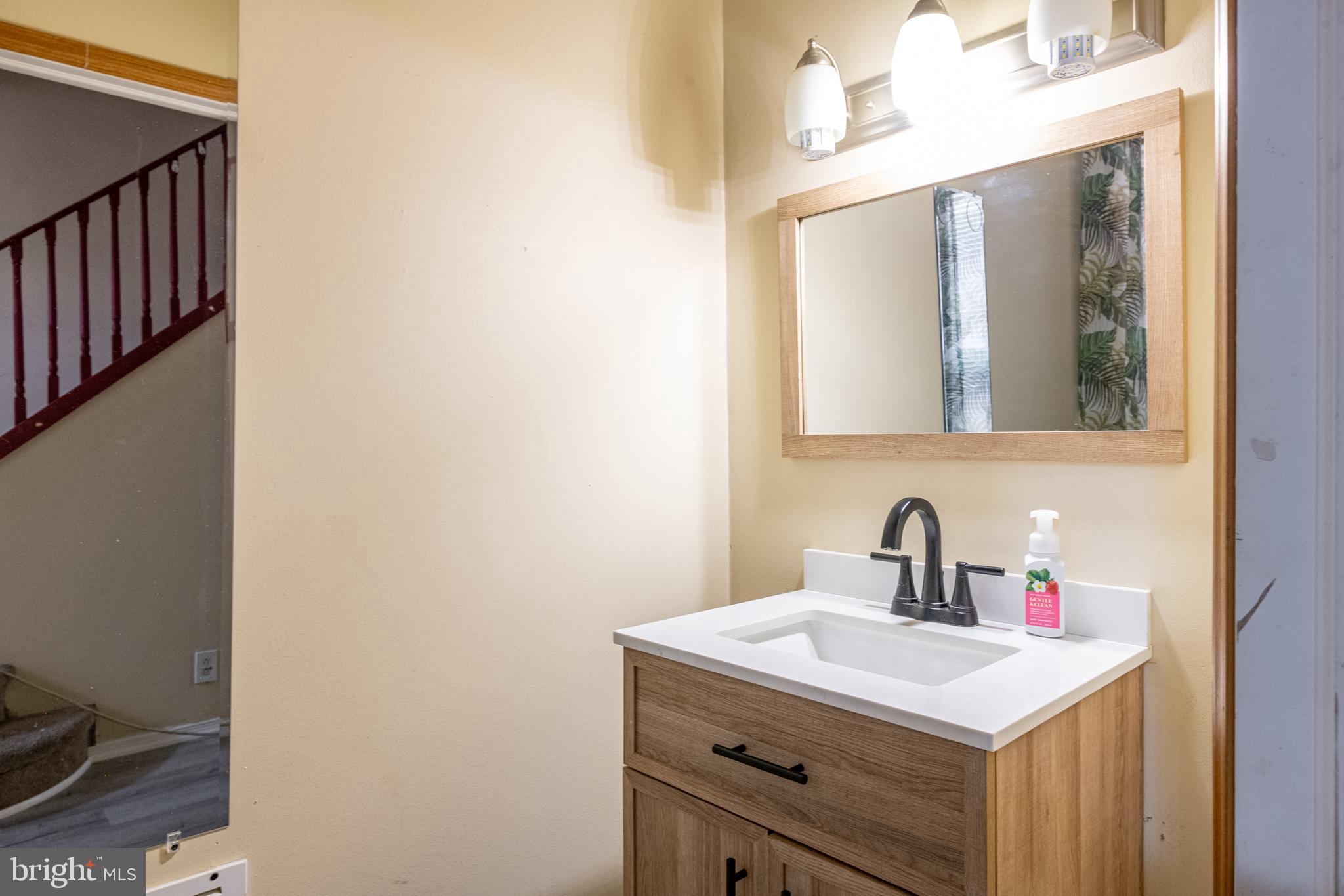 1711 Perkiomen Avenue Reading, PA 19602 - Photo 6 of 20 a bathroom with a sink and a mirror