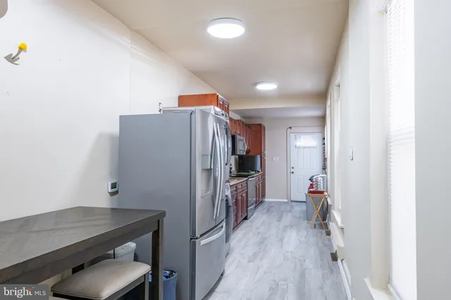 a view of a kitchen with washer and dryer