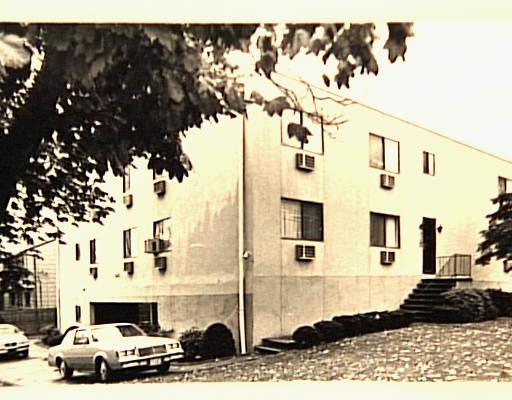 735 Cove Road, Unit 2D Stamford, CT 06902 - Photo 1 of 1 a black car parked in front of a building