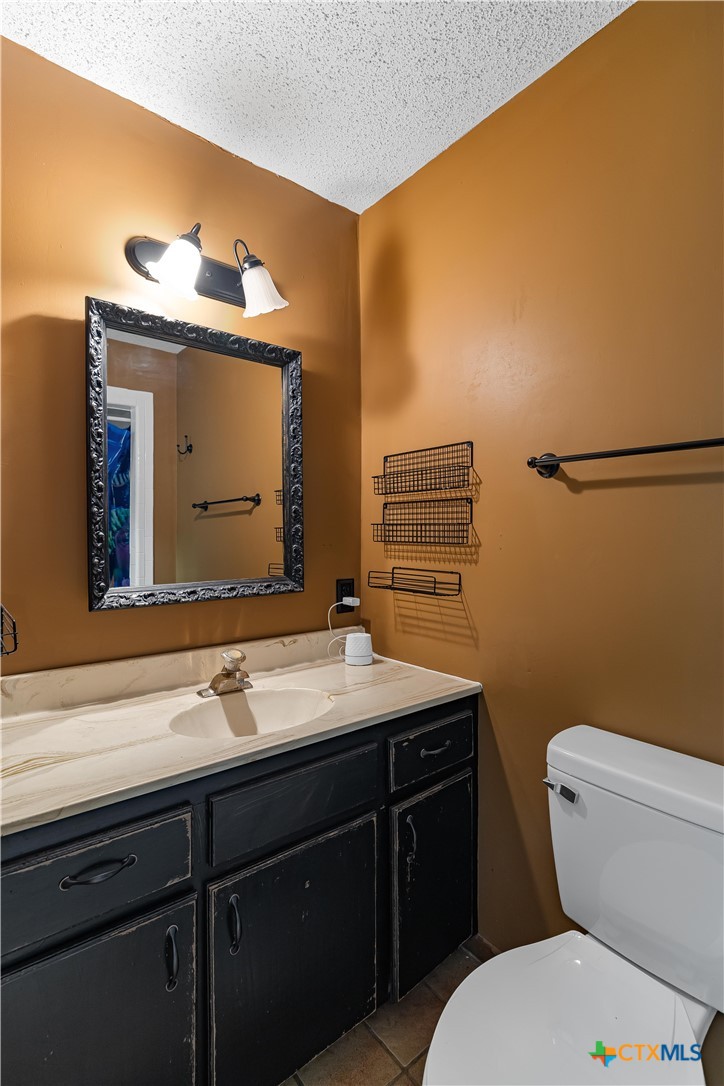 20 Hambleton Road Victoria, TX 77905 - Photo 19 of 48 a bathroom with a sink a toilet and mirror
