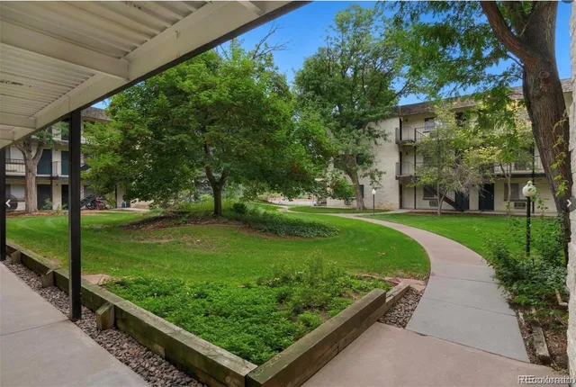 a view of a swimming pool with chairs
