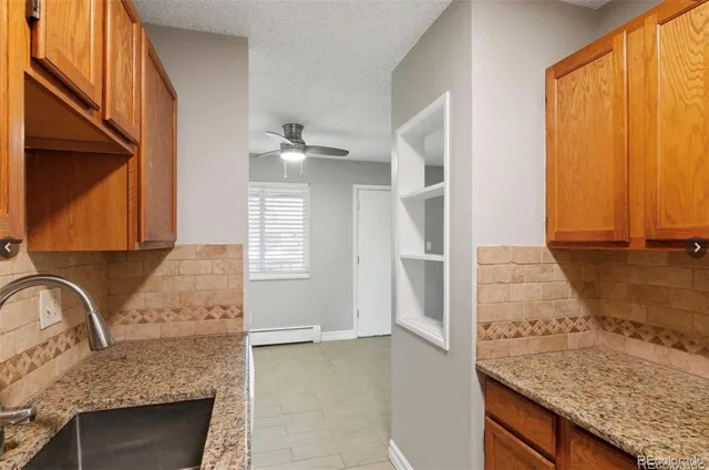 a view of an empty room and a window