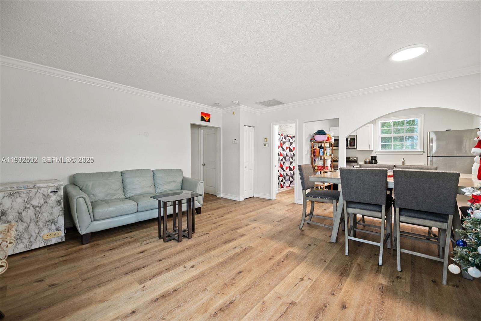 6894 3rd Street Jupiter, FL 33458 - Photo 11 of 29 a living room with furniture and a wooden floor