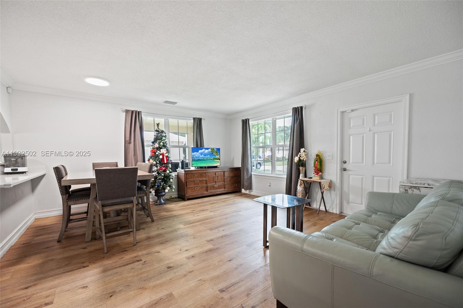 6894 3rd Street Jupiter, FL 33458 - Photo 12 of 29 a living room with furniture and wooden floor