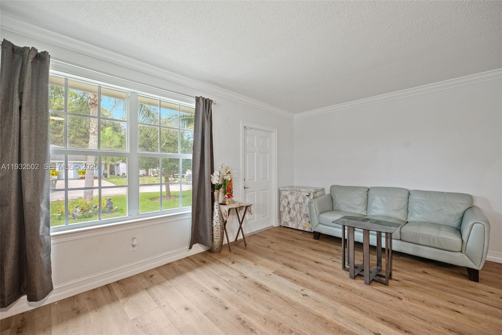 6894 3rd Street Jupiter, FL 33458 - Photo 13 of 29 a living room with furniture and a wooden floor