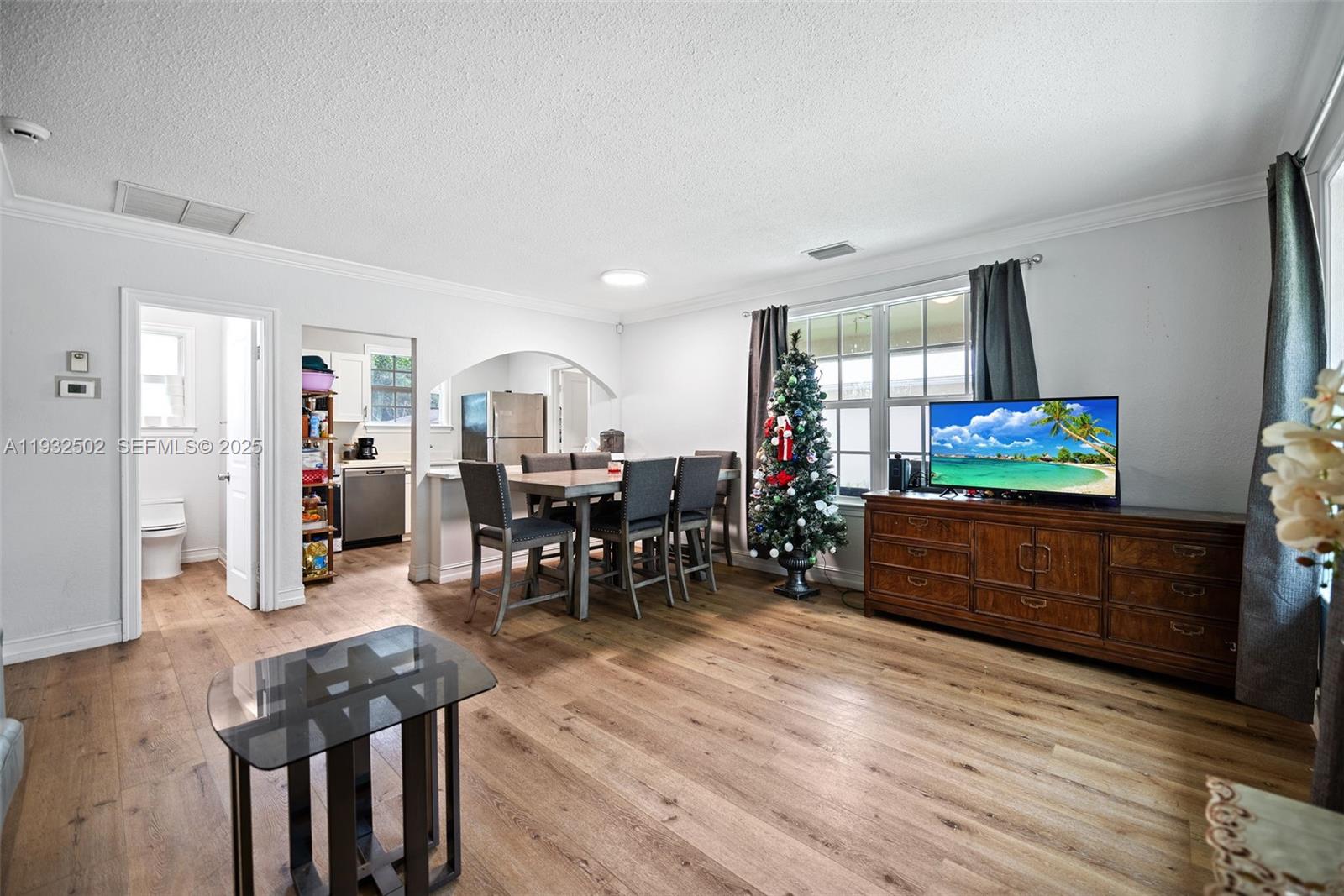 6894 3rd Street Jupiter, FL 33458 - Photo 19 of 29 a living room with furniture and a flat screen tv