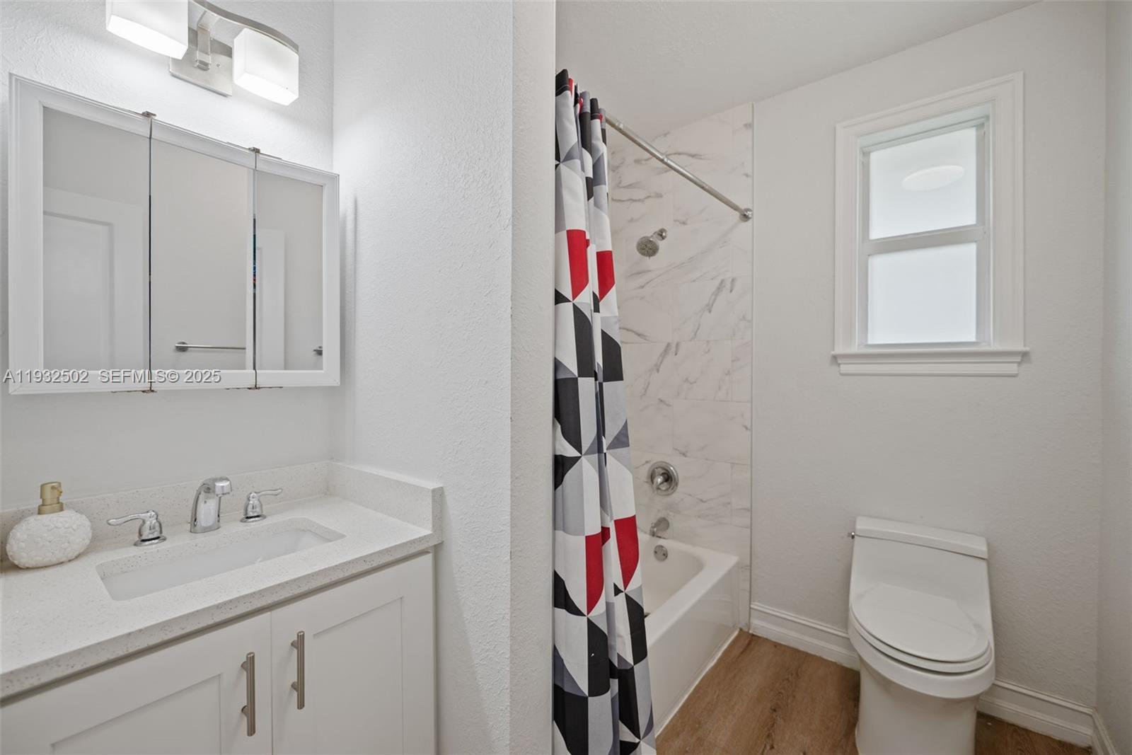 6894 3rd Street Jupiter, FL 33458 - Photo 22 of 29 a bathroom with a sink vanity granite and toilet