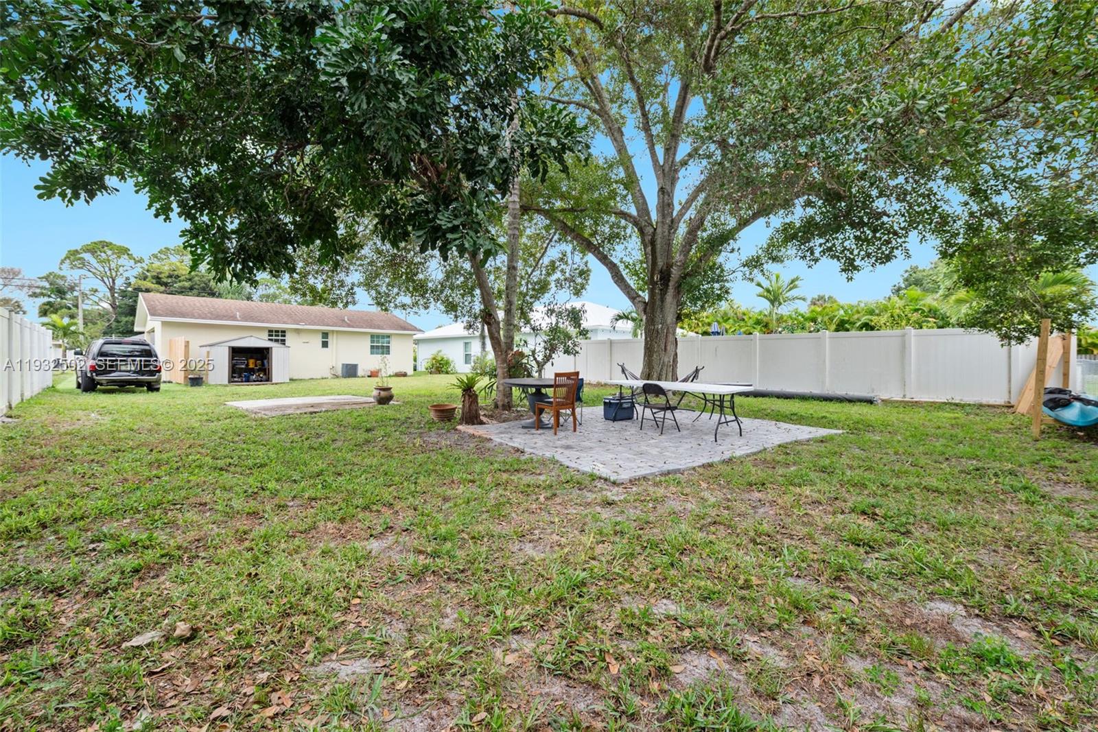 6894 3rd Street Jupiter, FL 33458 - Photo 26 of 29 a house view with a sitting space and garden