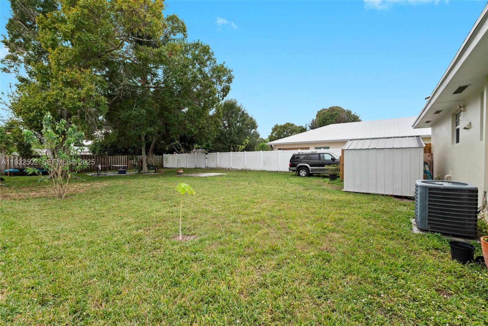 6894 3rd Street Jupiter, FL 33458 - Photo 29 of 29 a swimming pool with some trees in the background