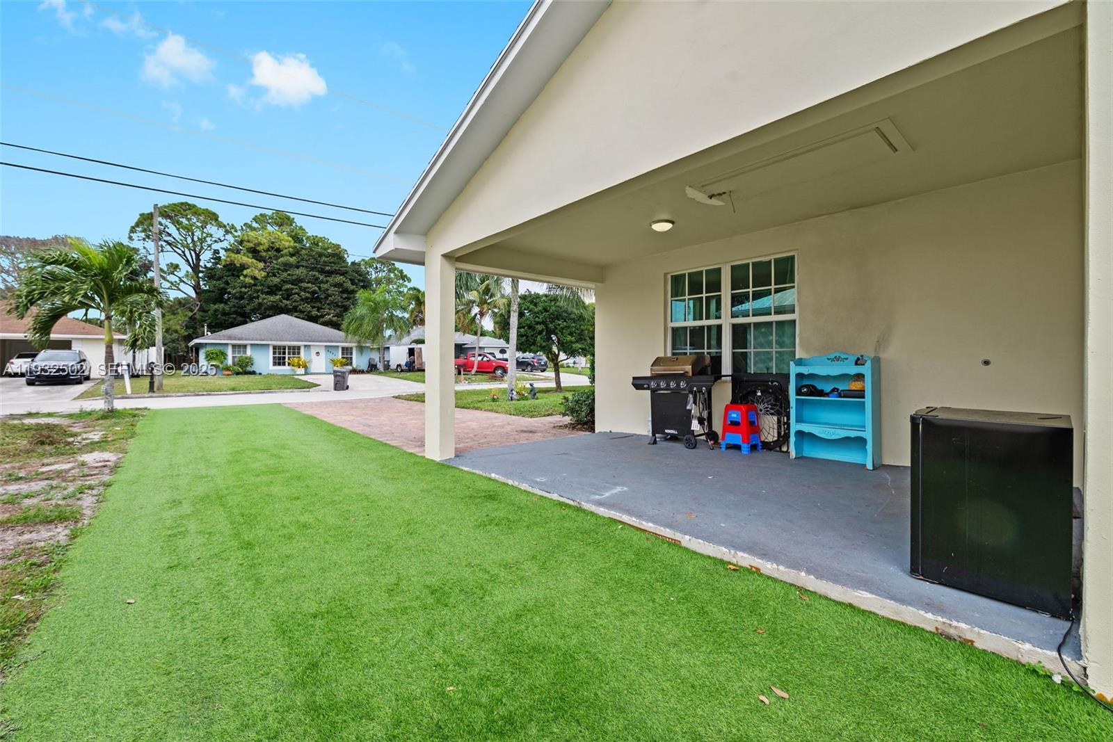 6894 3rd Street Jupiter, FL 33458 - Photo 7 of 29 a childrens park with lots of swings and slides