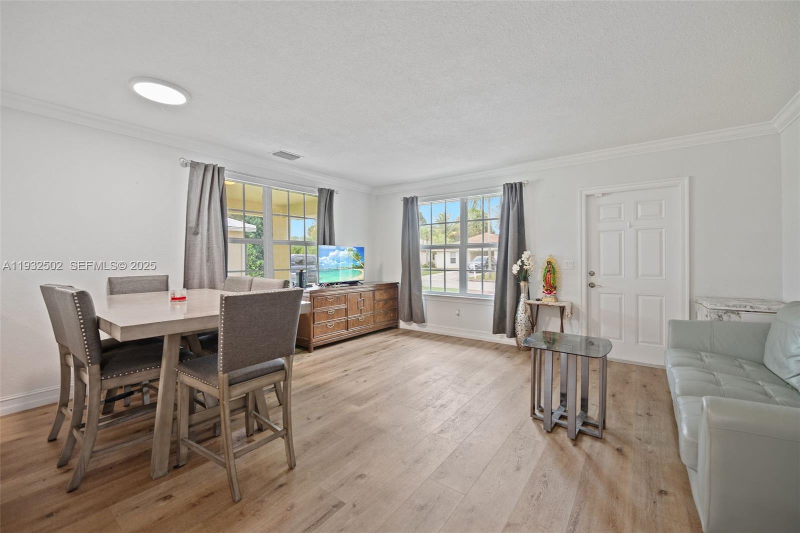 6894 3rd Street Jupiter, FL 33458 - Photo 9 of 29 a view of a livingroom with furniture window and wooden floor