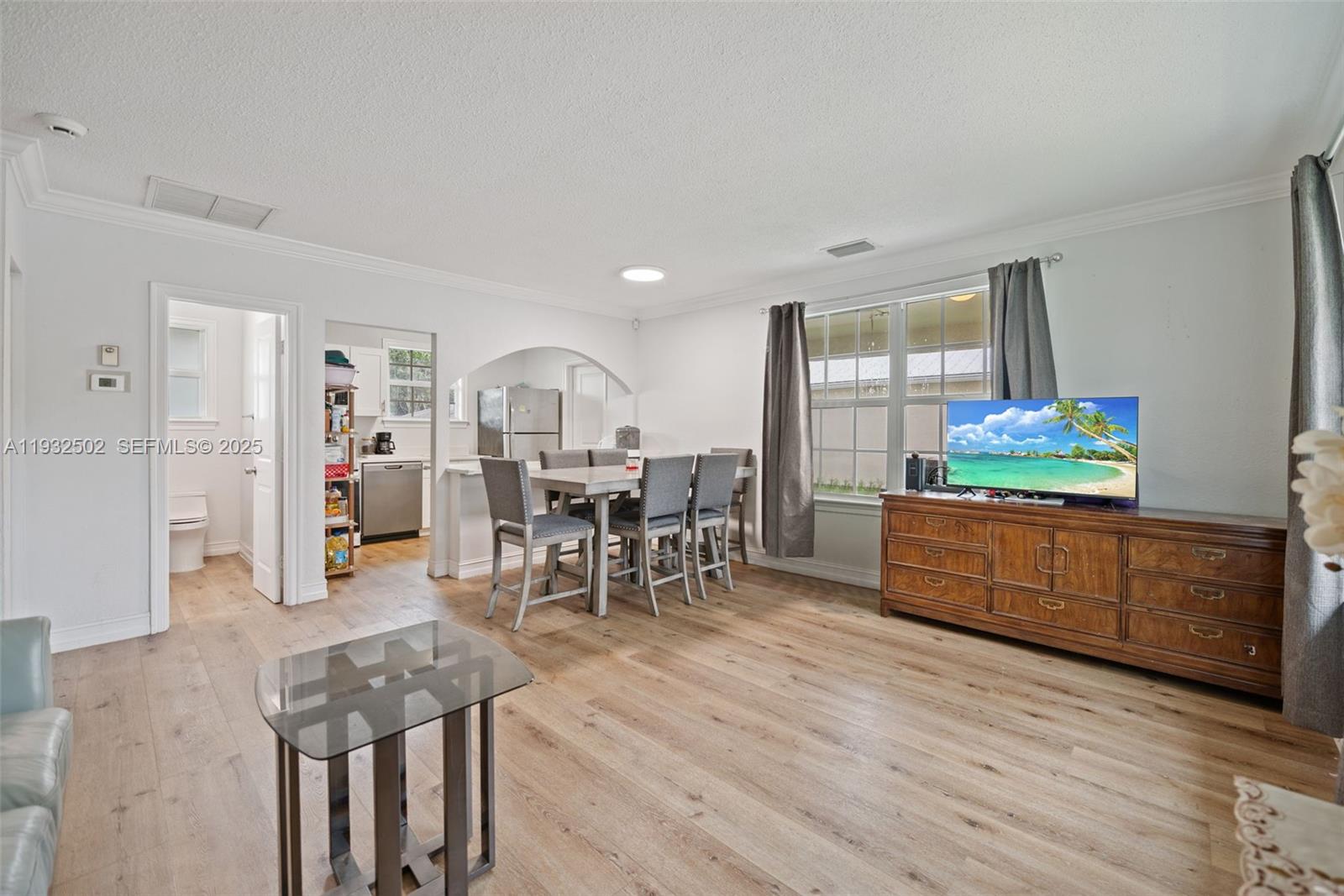 6894 3rd Street Jupiter, FL 33458 - Photo 10 of 29 a living room with furniture and wooden floors