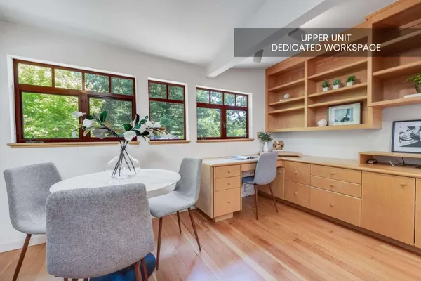 a kitchen with a table chairs sink and cabinets