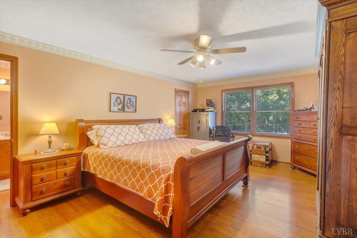 737 Homeplace Road Rustburg, VA 24588 - Photo 20 of 73 a bed room with a bed and a tv