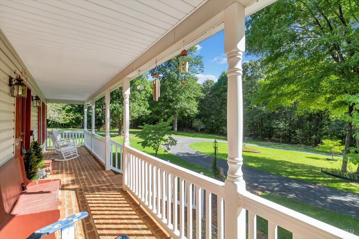 737 Homeplace Road Rustburg, VA 24588 - Photo 3 of 73 a view of a porch with chairs and backyard