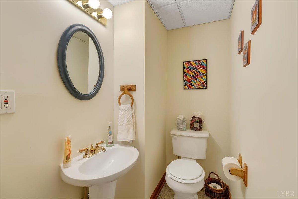 737 Homeplace Road Rustburg, VA 24588 - Photo 36 of 73 a bathroom with a toilet sink and mirror