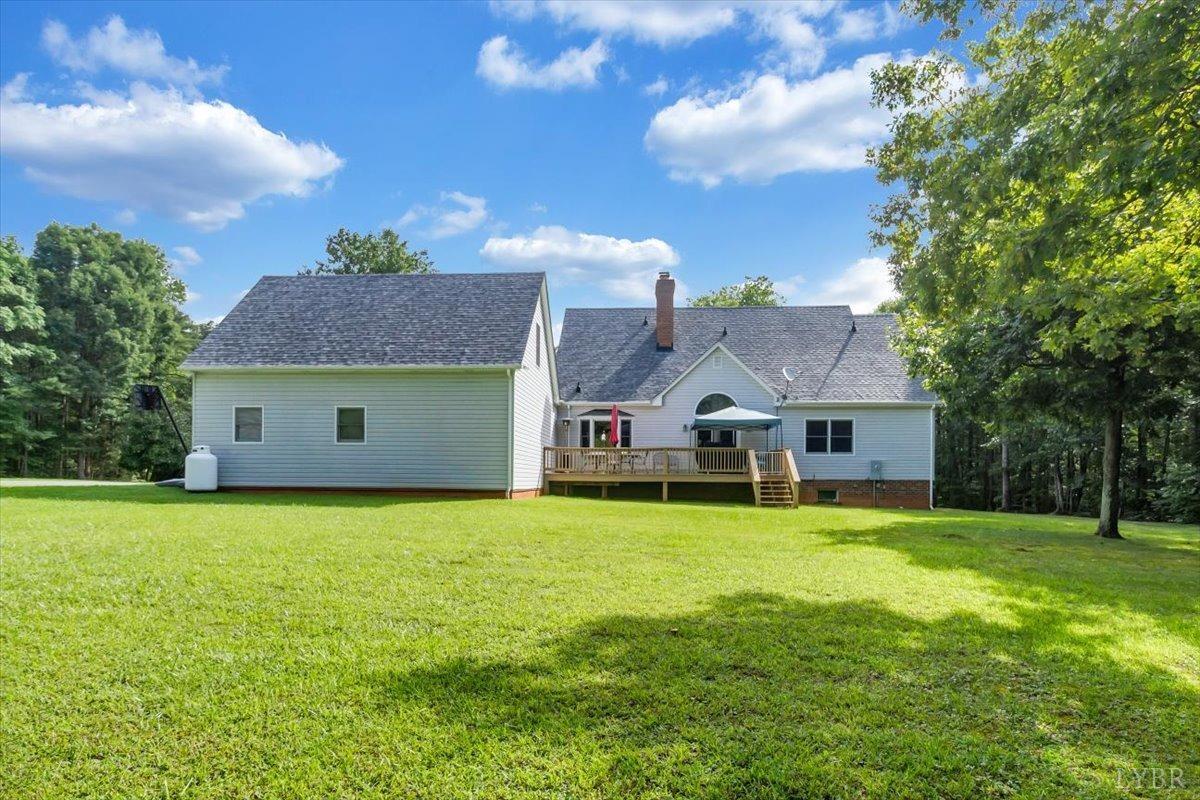 737 Homeplace Road Rustburg, VA 24588 - Photo 48 of 73 a front view of house with yard and trees in the background
