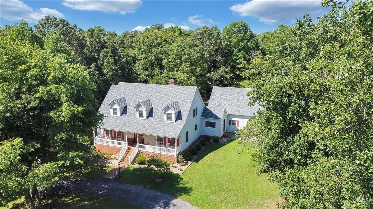 737 Homeplace Road Rustburg, VA 24588 - Photo 55 of 73 an aerial view of a house with a yard and trees in the background