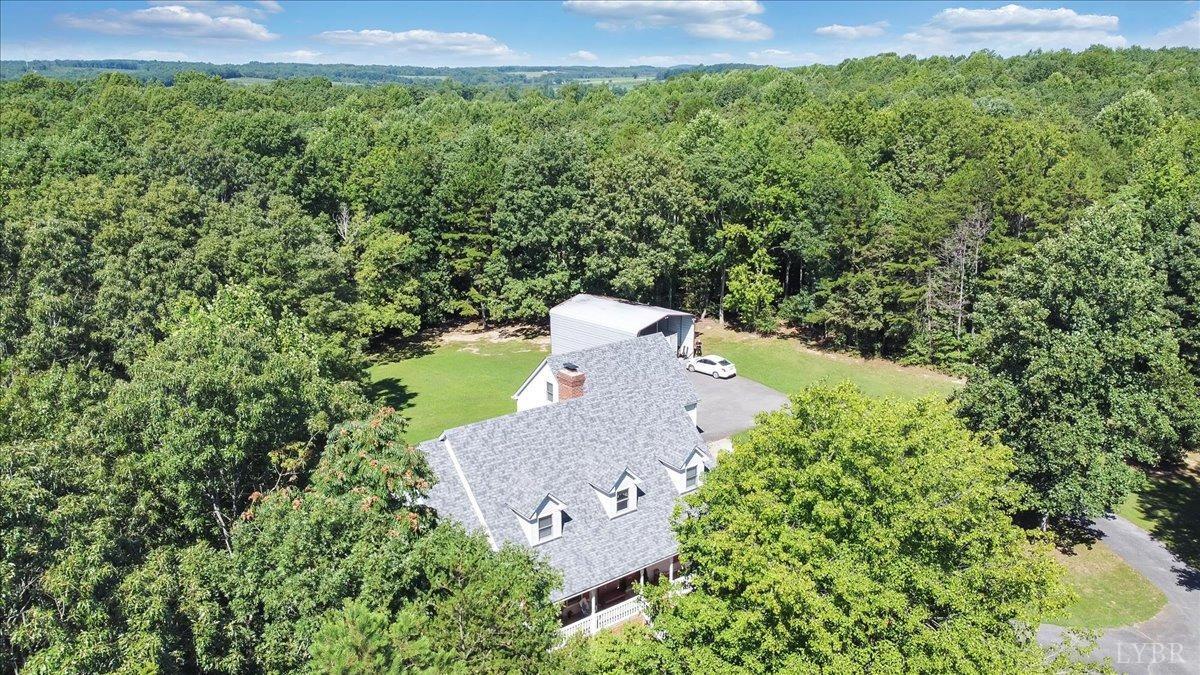737 Homeplace Road Rustburg, VA 24588 - Photo 57 of 73 an aerial view of a house with a yard and trees all around