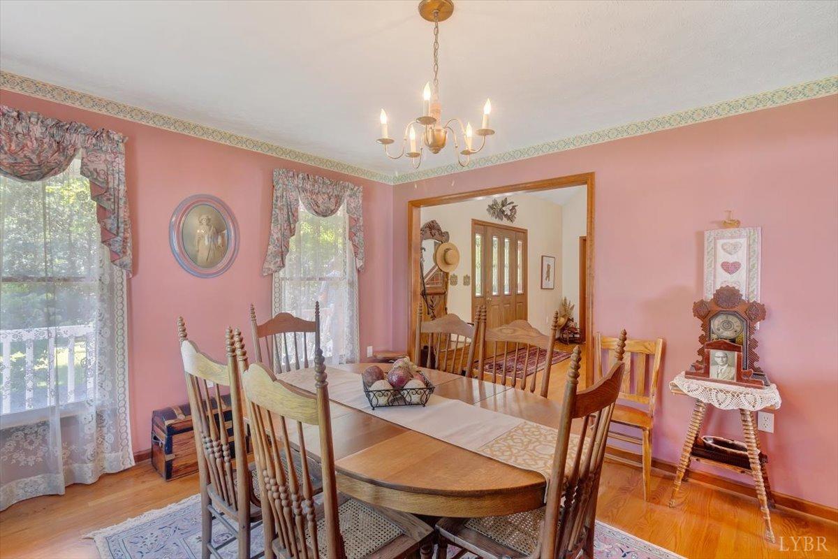 737 Homeplace Road Rustburg, VA 24588 - Photo 8 of 73 a view of a dining room with furniture window and wooden floor