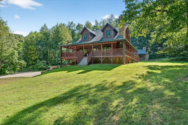 a view of a house with a big yard