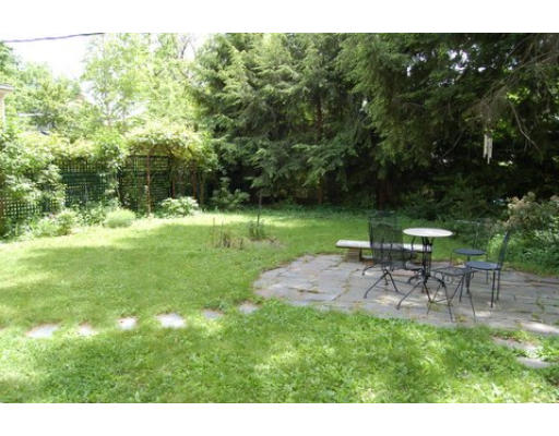 83 Washington Avenue, Unit CH Cambridge, MA 02140 - Photo 4 of 11 a view of a table and chairs in the garden