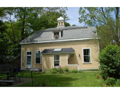 83 Washington Avenue, Unit CH Cambridge, MA 02140 - Photo 5 of 11 a front view of a house with a garden