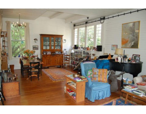 83 Washington Avenue, Unit CH Cambridge, MA 02140 - Photo 7 of 11 a living room with furniture and a large window