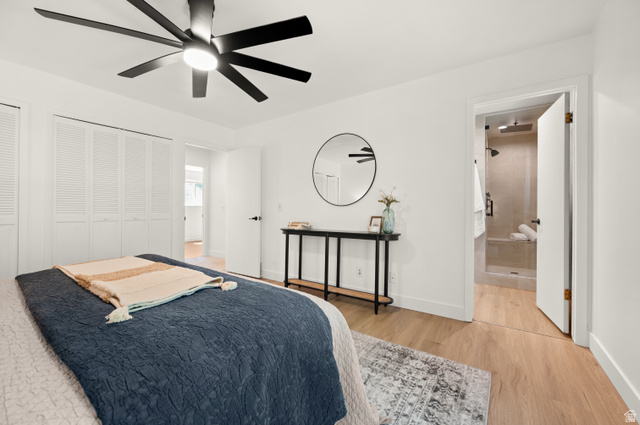 2163 Borg Drive Sandy, UT 84092 - Photo 15 of 31 Bedroom with two closets, light wood-type flooring, ceiling fan, and ensuite bathroom