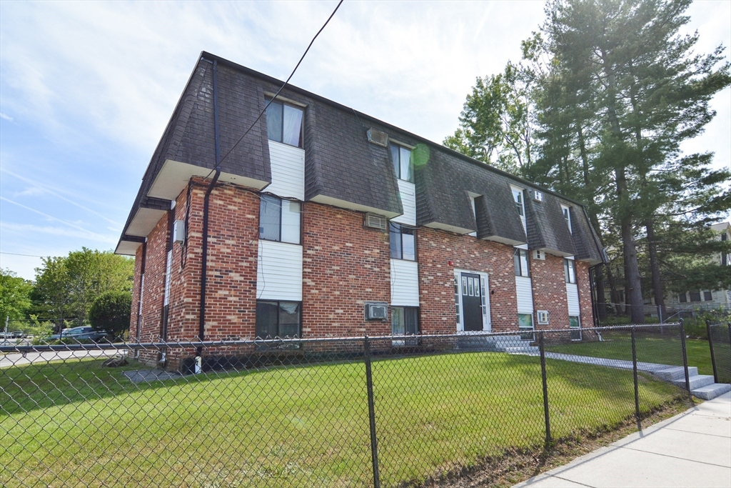 16 A Exeter Street Lawrence, MA 01843 - Photo 2 of 12 a front view of a house with a yard