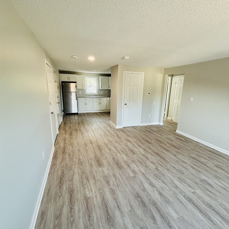 16 A Exeter Street Lawrence, MA 01843 - Photo 4 of 12 a view of a livingroom with wooden floor