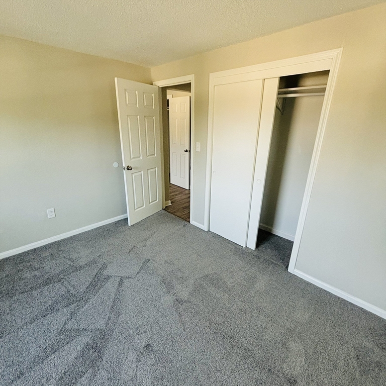 16 A Exeter Street Lawrence, MA 01843 - Photo 6 of 12 an empty room with closet area