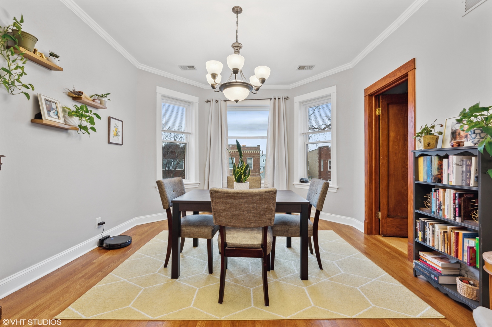 2441 North Avers Avenue Chicago, IL 60647 - Photo 14 of 28 a dining room with furniture a rug and wooden floor