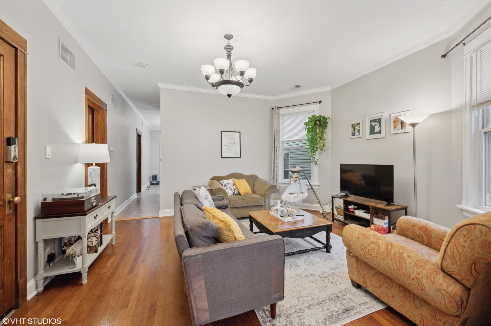 2441 North Avers Avenue Chicago, IL 60647 - Photo 16 of 28 a living room with furniture and a flat screen tv